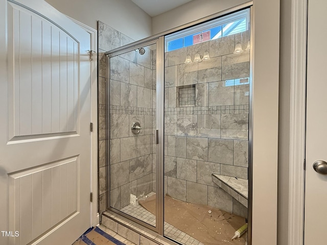 bathroom with a shower stall