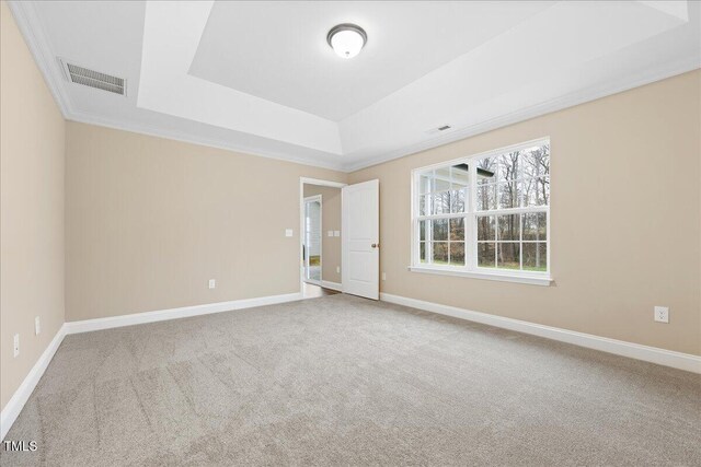 1985 Meadowview Dr, Graham, NC 27253 - unfurnished room with a tray ceiling, baseboards, visible vents, and carpet