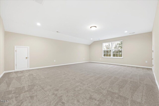 1985 Meadowview Dr, Graham, NC 27253 - spare room featuring baseboards, vaulted ceiling, recessed lighting, and carpet