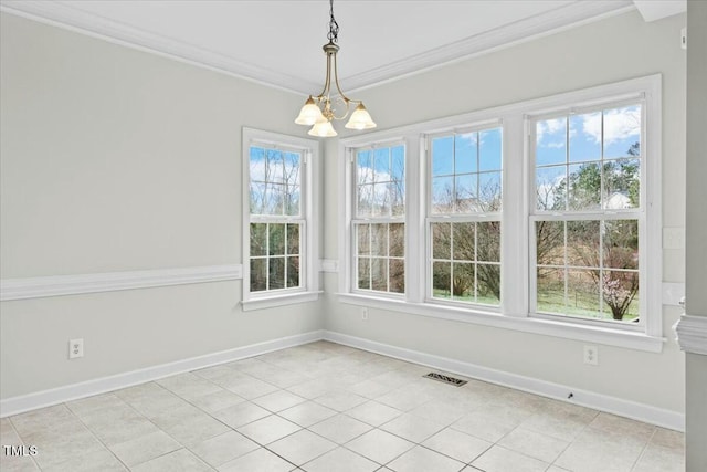 unfurnished dining area with a chandelier, a wealth of natural light, visible vents, and crown molding