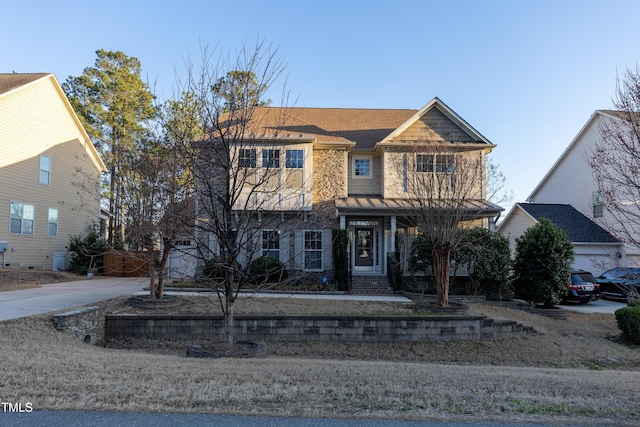 view of front facade featuring concrete driveway