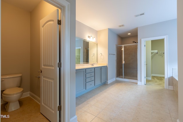 bathroom with visible vents, baseboards, toilet, a stall shower, and vanity