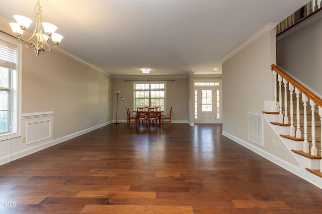 interior space featuring stairs, wood finished floors, visible vents, and ornamental molding