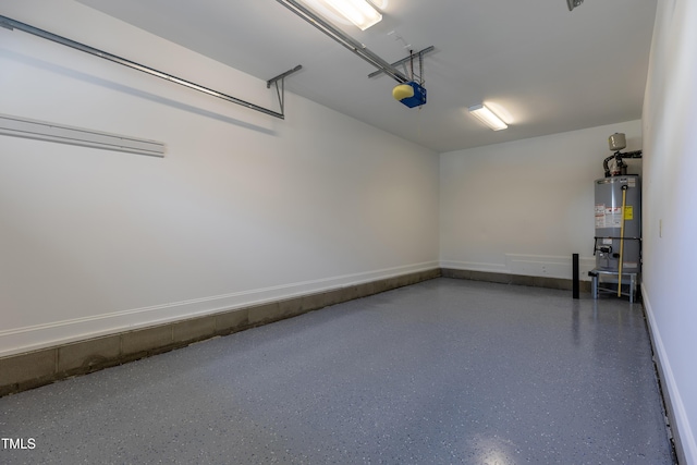 garage featuring a garage door opener and water heater