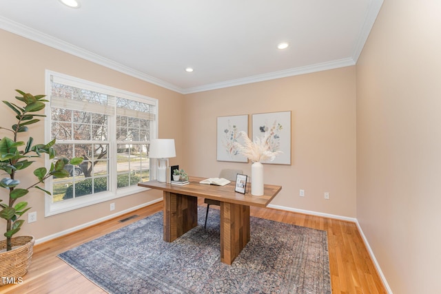 office featuring crown molding, baseboards, and wood finished floors