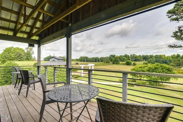 wooden deck with a lawn