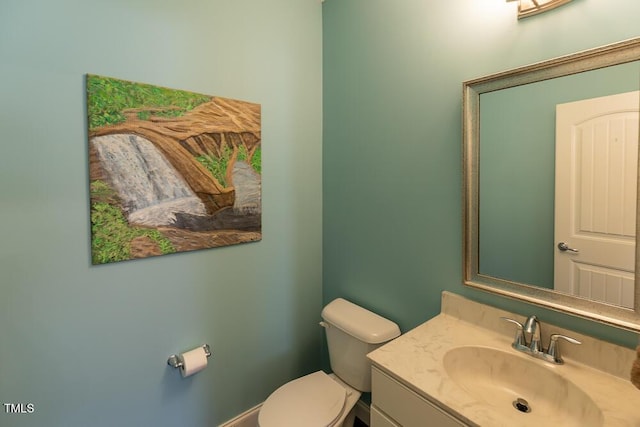 bathroom featuring toilet and vanity