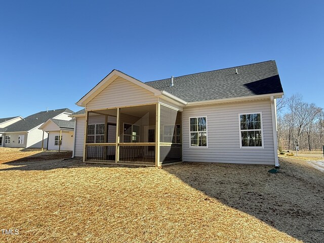 1987 Meadowview Dr, Graham, NC 27253 - rear view of house with a sunroom and roof with shingles