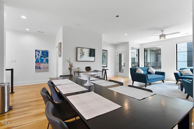 dining area featuring light wood-style floors, baseboards, and recessed lighting