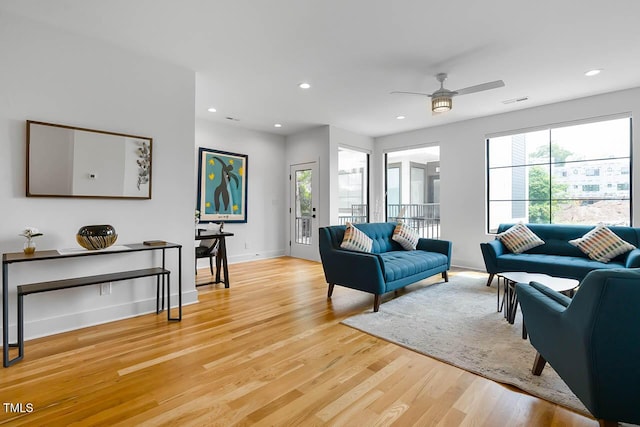 living area with recessed lighting, a ceiling fan, baseboards, visible vents, and light wood finished floors