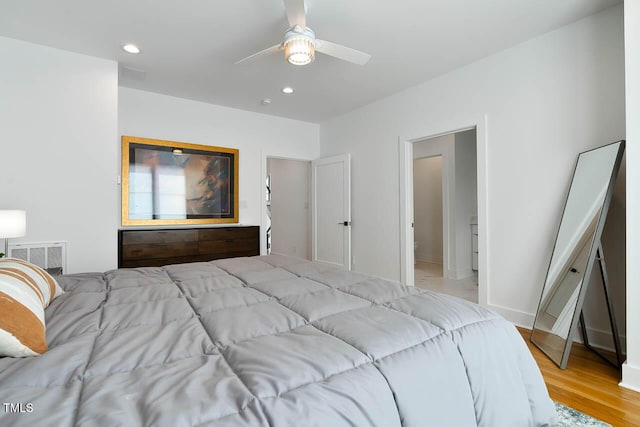 bedroom featuring ceiling fan, visible vents, wood finished floors, and recessed lighting