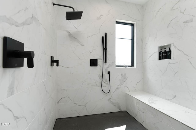 bathroom with a marble finish shower