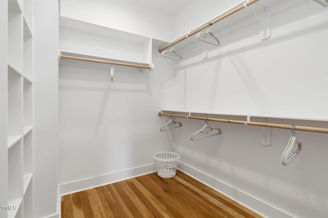 spacious closet with wood finished floors