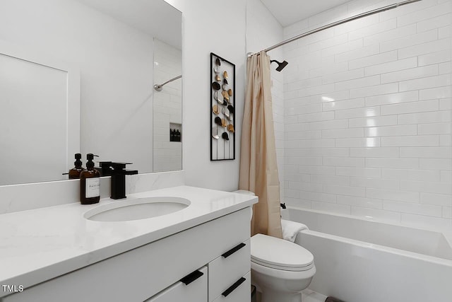 bathroom with vanity, toilet, and shower / bath combo with shower curtain