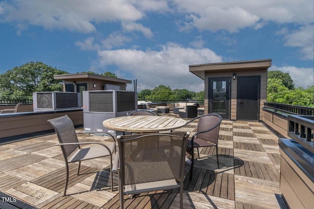 deck featuring outdoor dining area