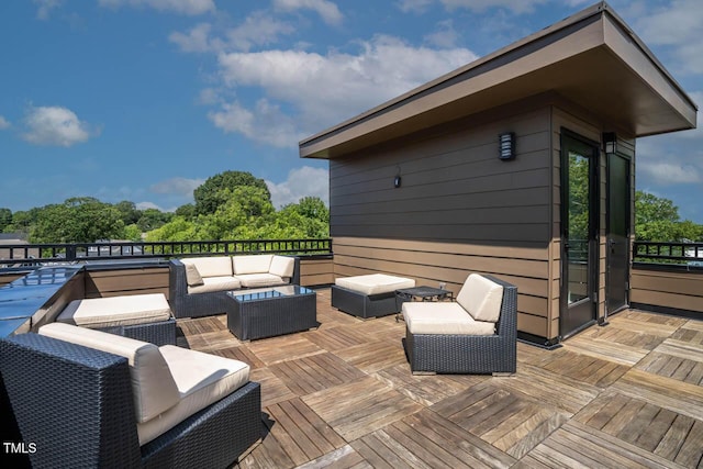 wooden terrace featuring an outdoor living space