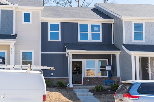 townhome / multi-family property featuring board and batten siding