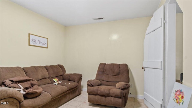 living room featuring baseboards and visible vents