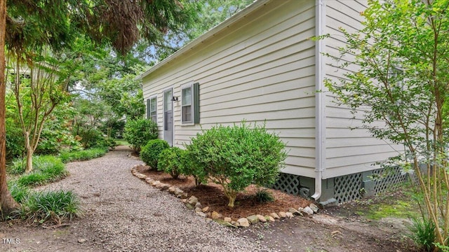 view of side of property with crawl space