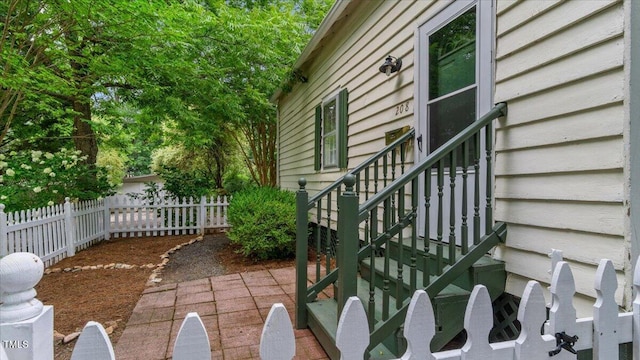 view of side of property featuring fence