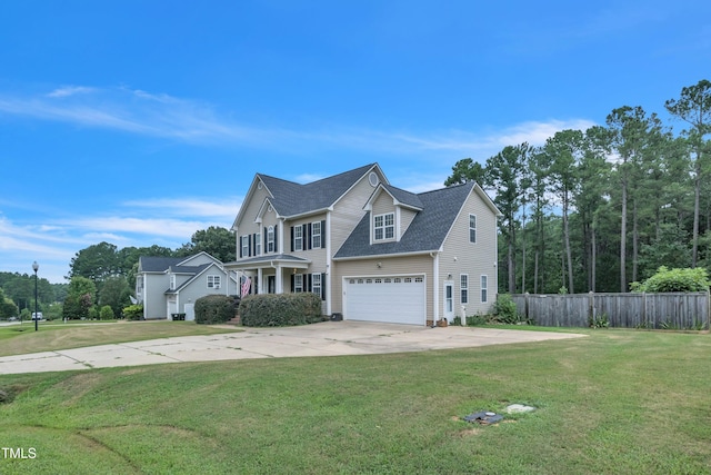 view of front of home featuring a garage, a shingled roof, concrete driveway, fence, and a front yard