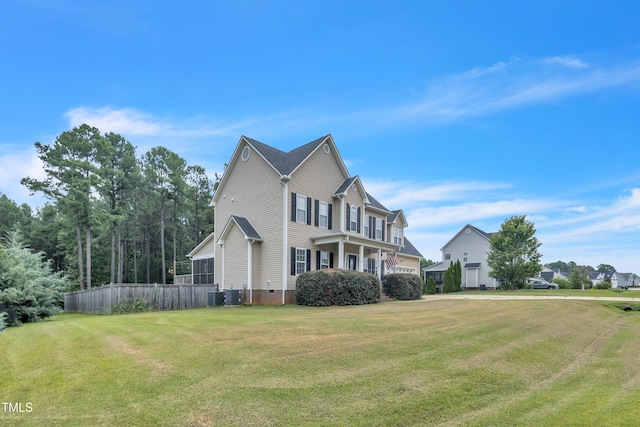 view of front of property with a front lawn, crawl space, central AC unit, and fence