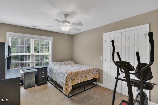 bedroom featuring ceiling fan, a closet, and visible vents