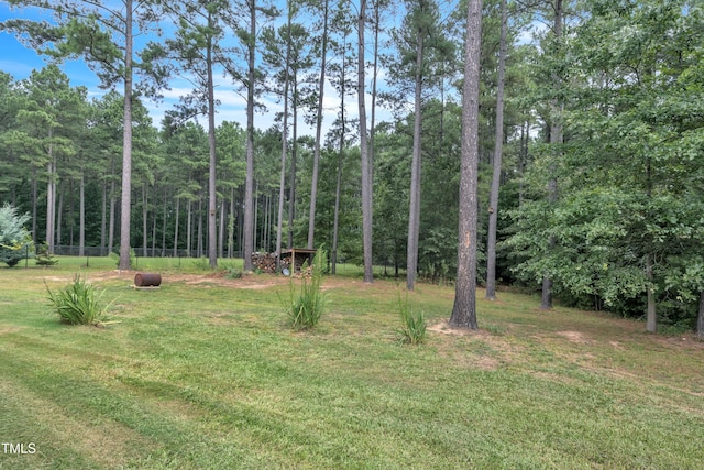 view of yard with a forest view