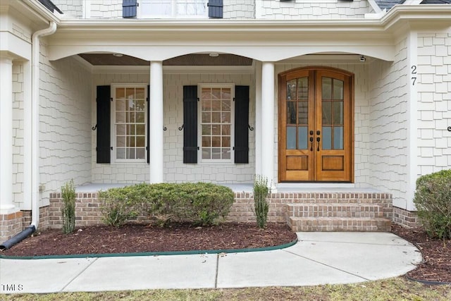 view of exterior entry featuring french doors