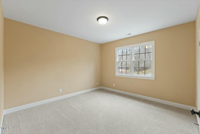 empty room with light carpet, visible vents, and baseboards