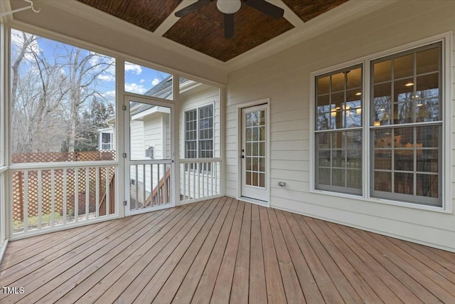 unfurnished sunroom with coffered ceiling and ceiling fan