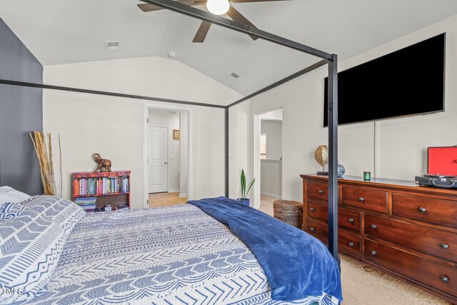 bedroom with vaulted ceiling, a ceiling fan, visible vents, and light colored carpet