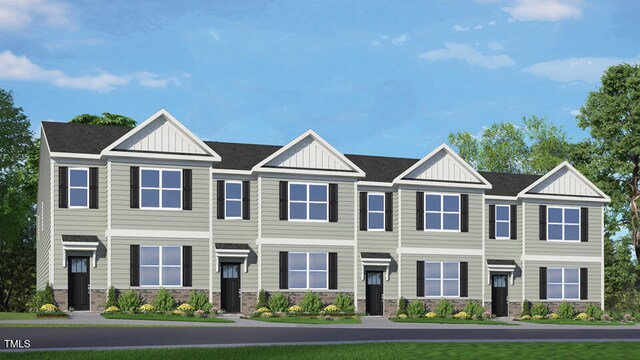 townhome / multi-family property with stone siding and board and batten siding