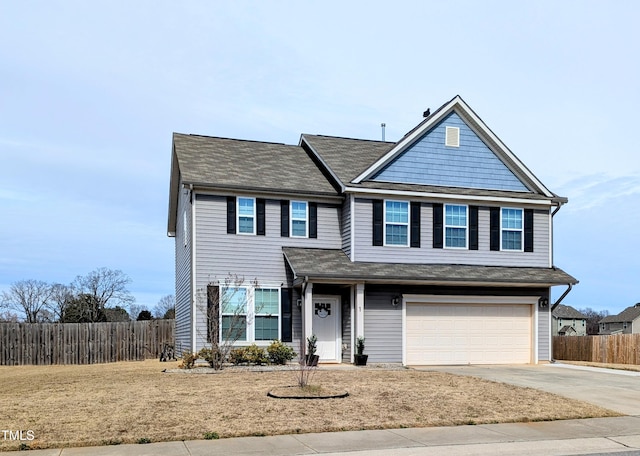 traditional-style house with driveway, a garage, and fence