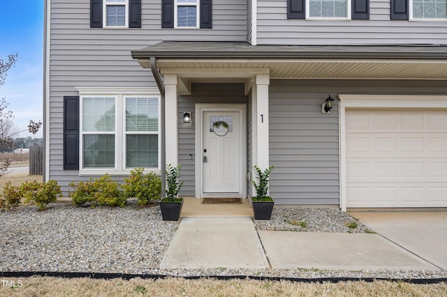 entrance to property with an attached garage