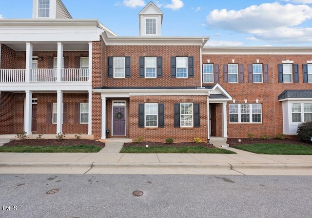 view of property with brick siding