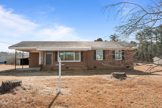 single story home with crawl space, brick siding, roof with shingles, and a front yard