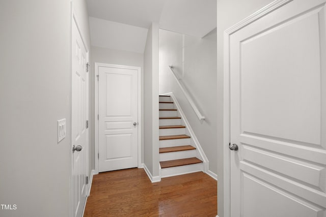 stairs with wood finished floors