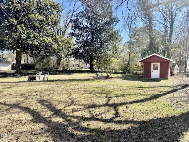 view of yard featuring an outbuilding and a shed