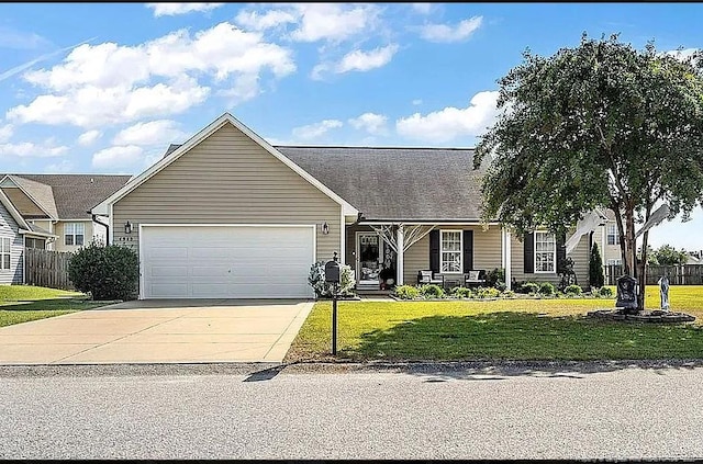 view of front of house featuring a garage, concrete driveway, fence, and a front lawn