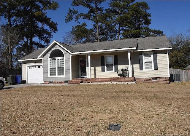 ranch-style home featuring crawl space, central air condition unit, an attached garage, and a front yard