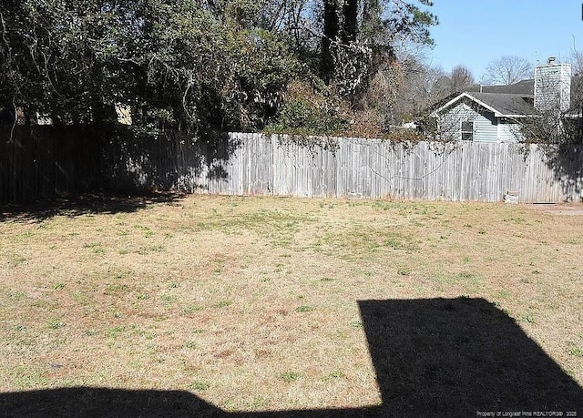 view of yard featuring fence