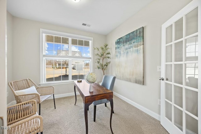 home office featuring visible vents, baseboards, and carpet flooring