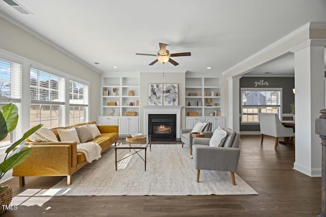 living room with visible vents and crown molding