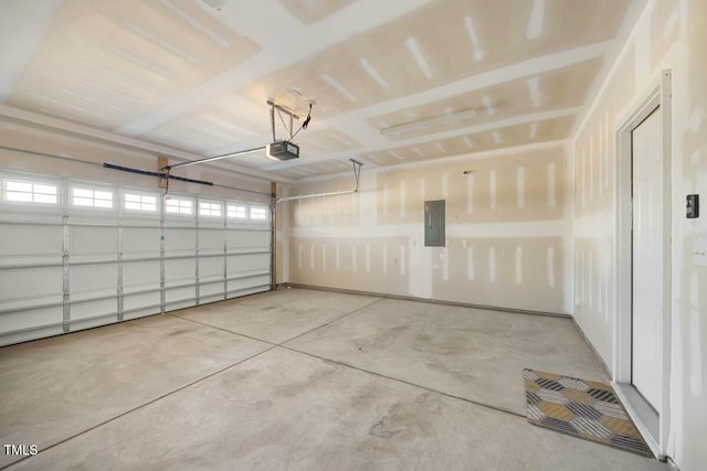 garage featuring a garage door opener and electric panel