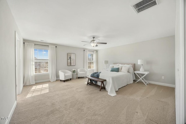 bedroom featuring visible vents, ceiling fan, light carpet, and baseboards