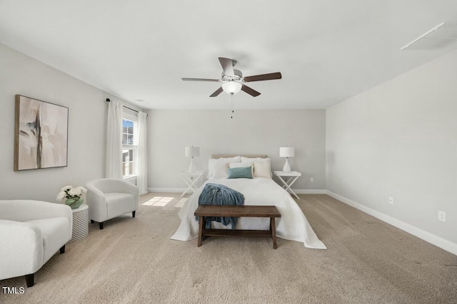 bedroom with a ceiling fan, light colored carpet, visible vents, and baseboards