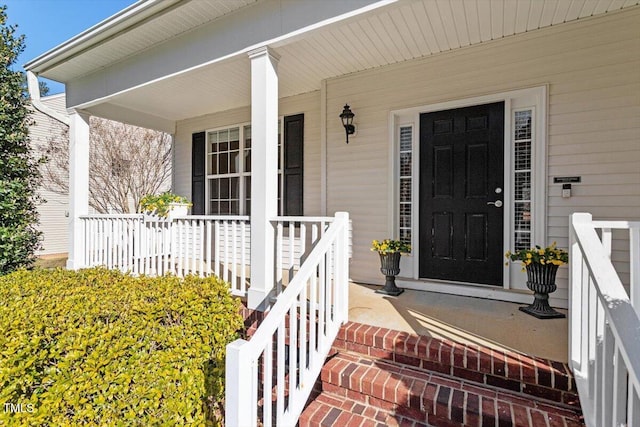 property entrance featuring a porch