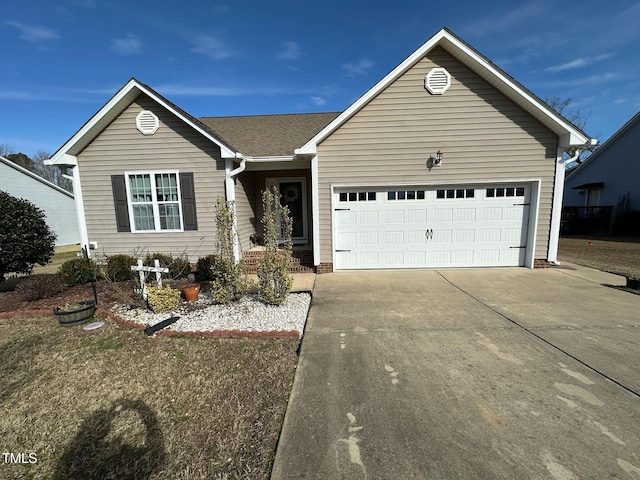 ranch-style home featuring an attached garage and concrete driveway