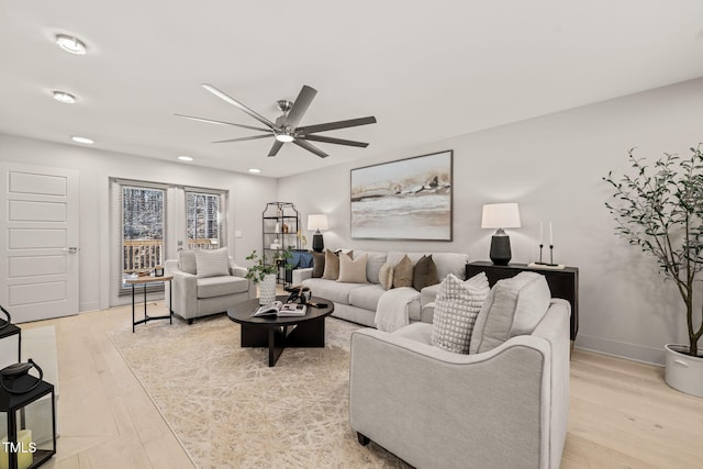 living area with ceiling fan, recessed lighting, baseboards, and light wood-style floors